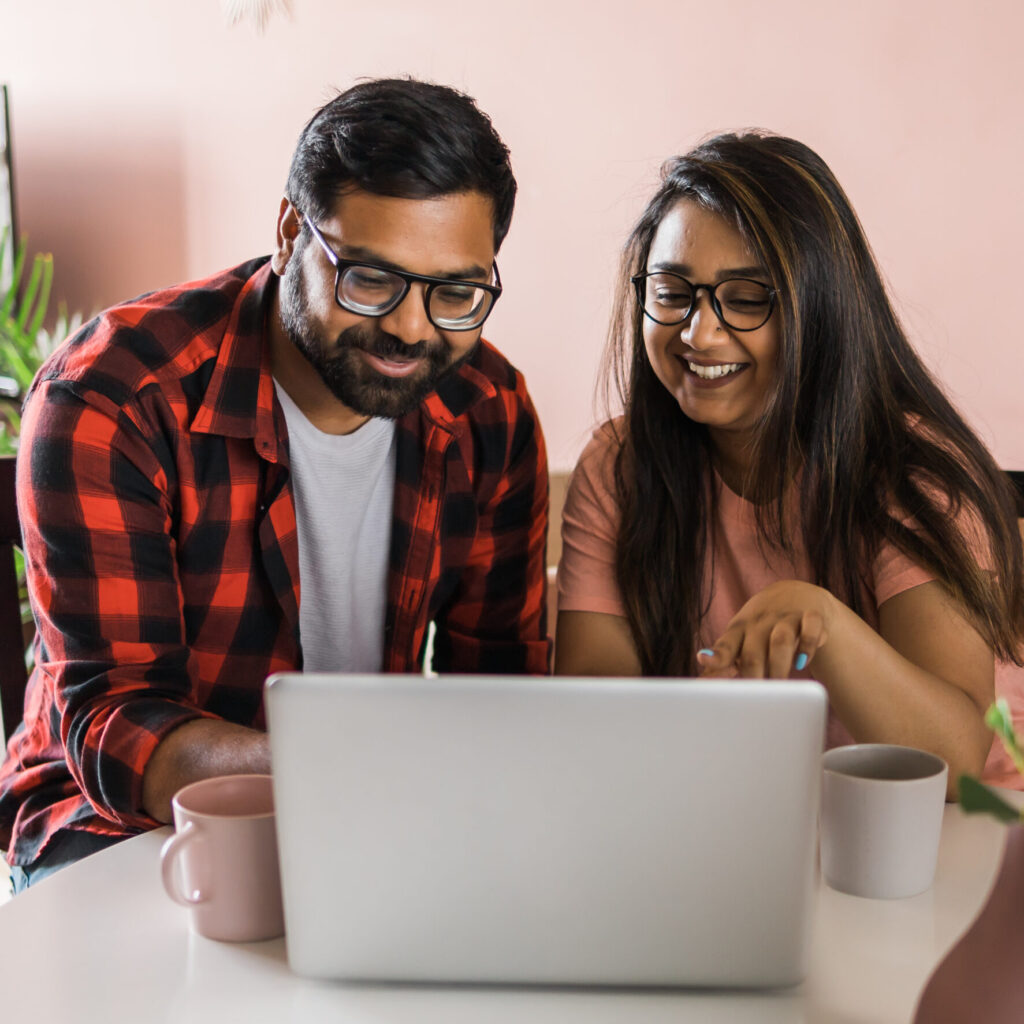 Couple looking happy using buffer free internet - FASTEL OTT apps